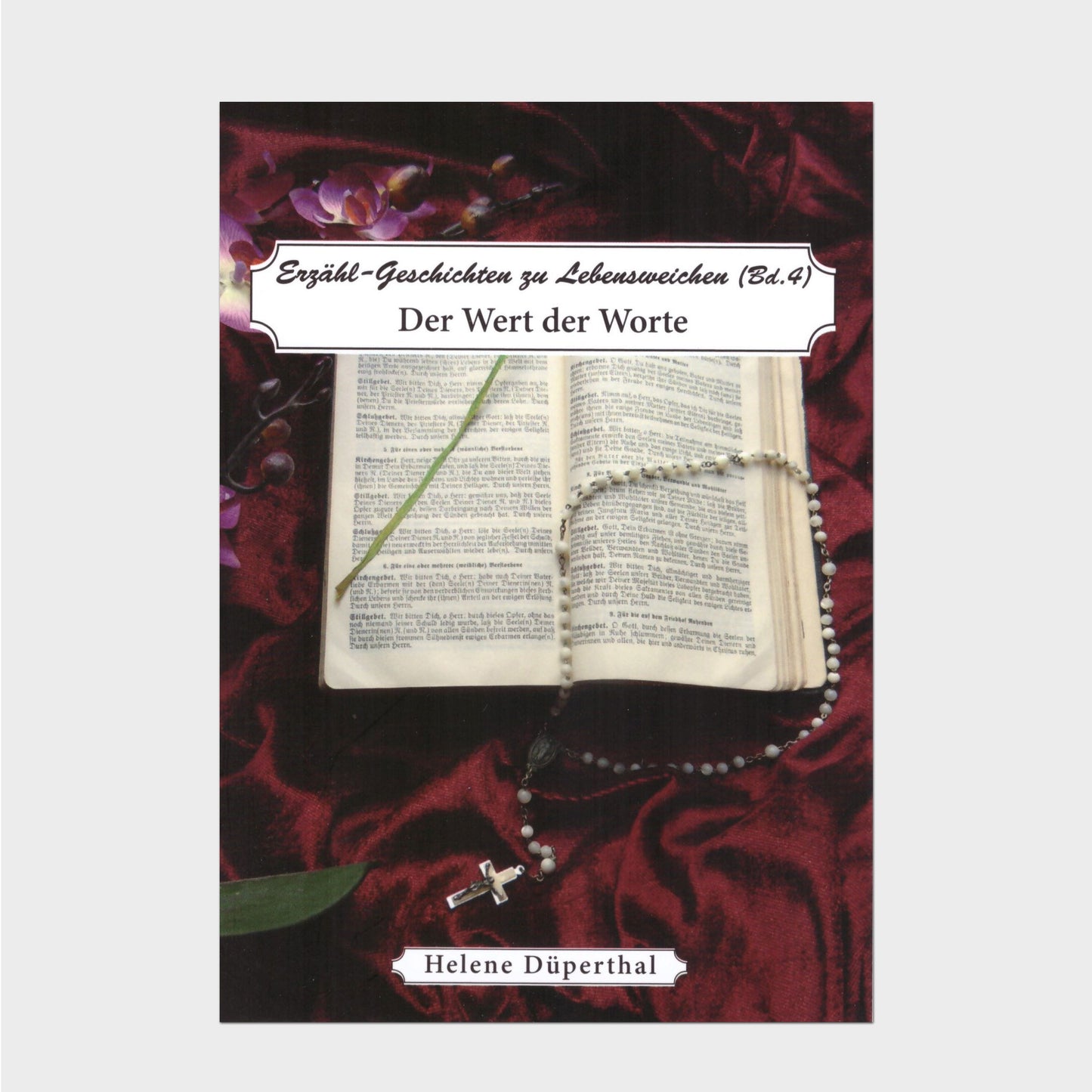 Buchcover Ein altes Gebetbuch und ein Rosenkranz auf dunkelrotem Samt